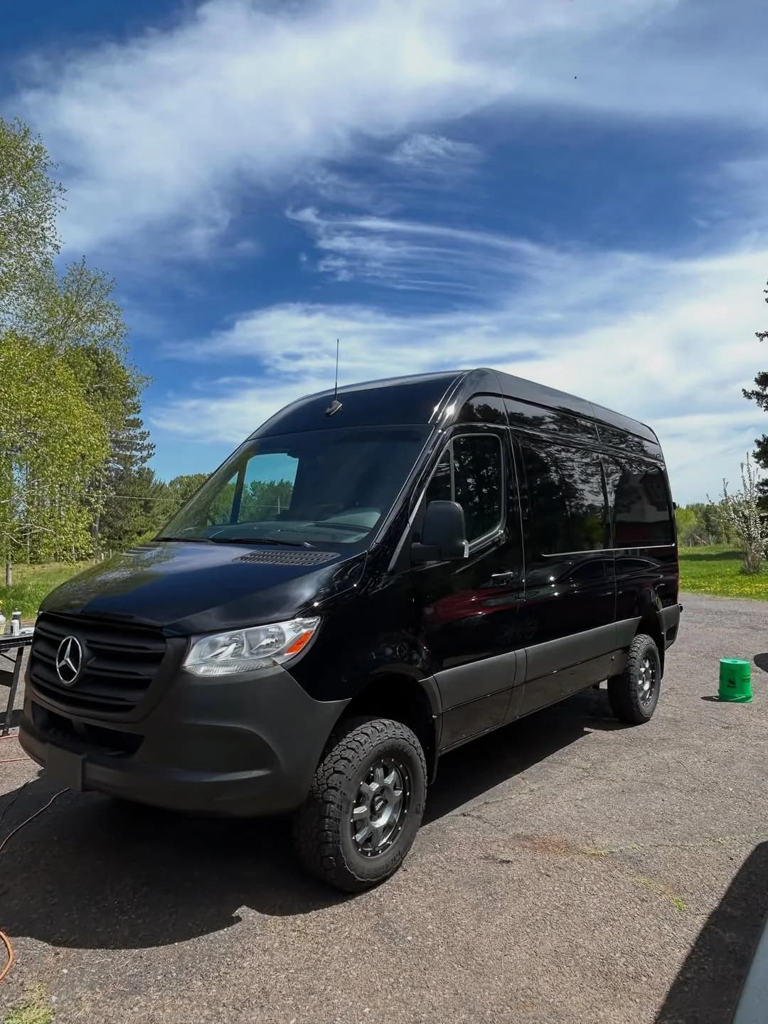 Glossy black Mercedes-Benz Sprinter after D&D exterior detailing, paint correction, and ceramic protection