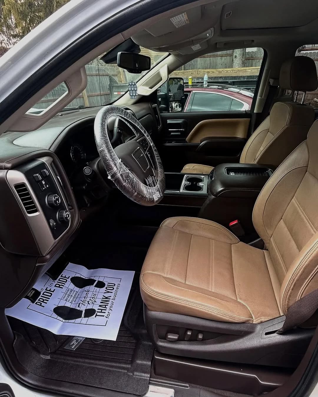 The same GMC Denali driver area after full interior detailing
