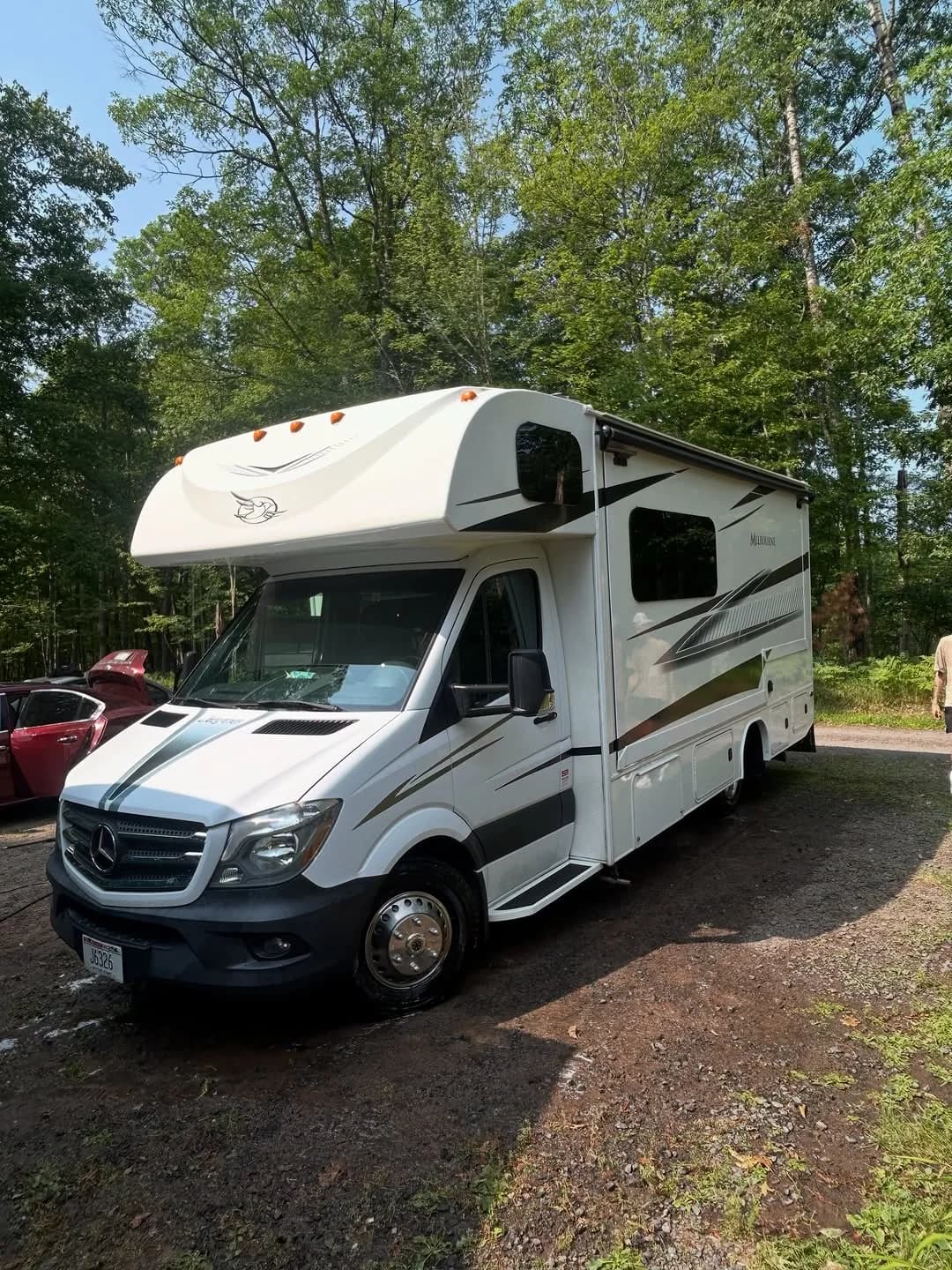 White Jayco Melbourne RV after exterior detailing, decontamination, and wax